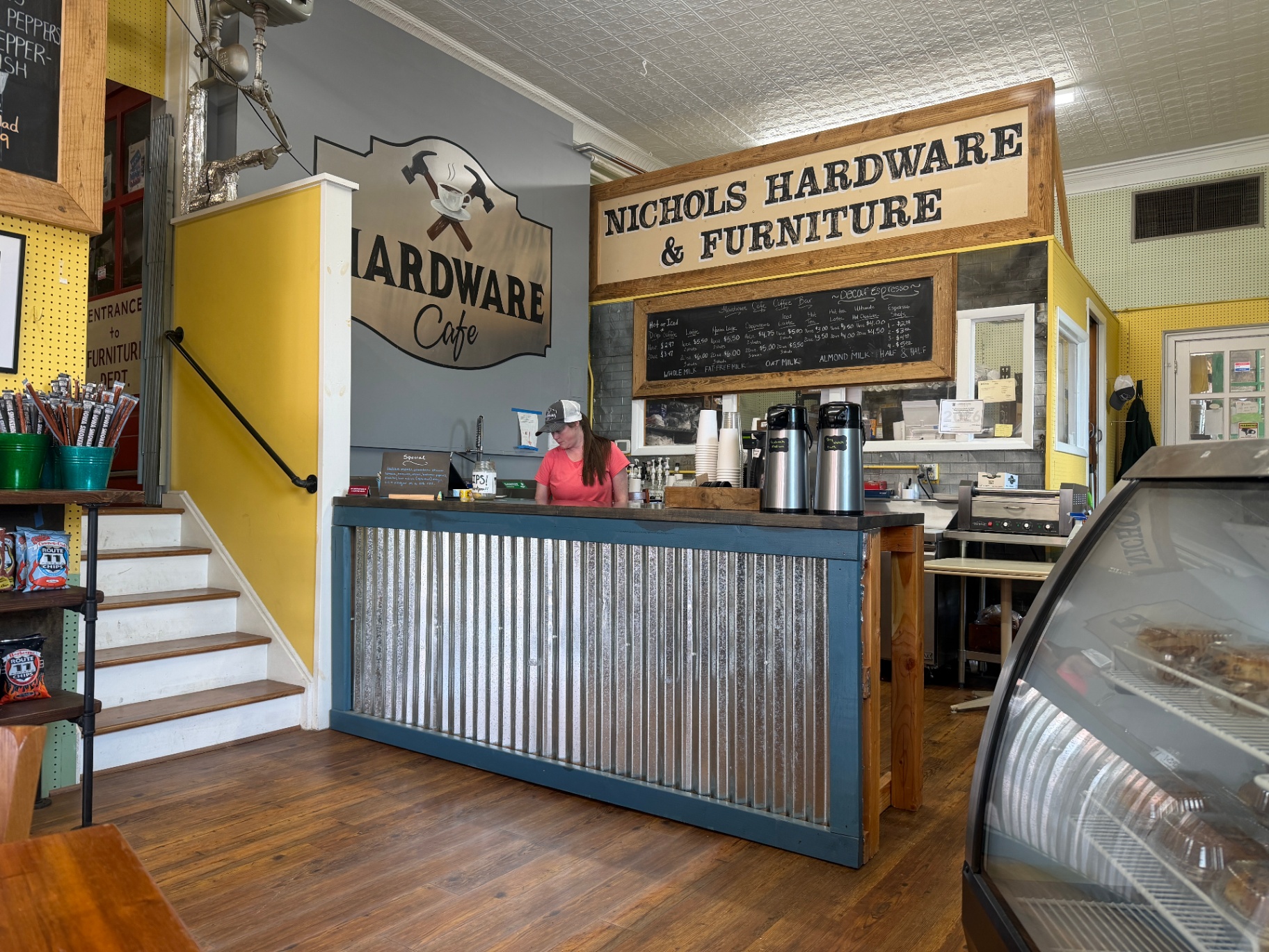 Inside The Hardware Cafe — counter with Nichols Hardware & Furniture sign